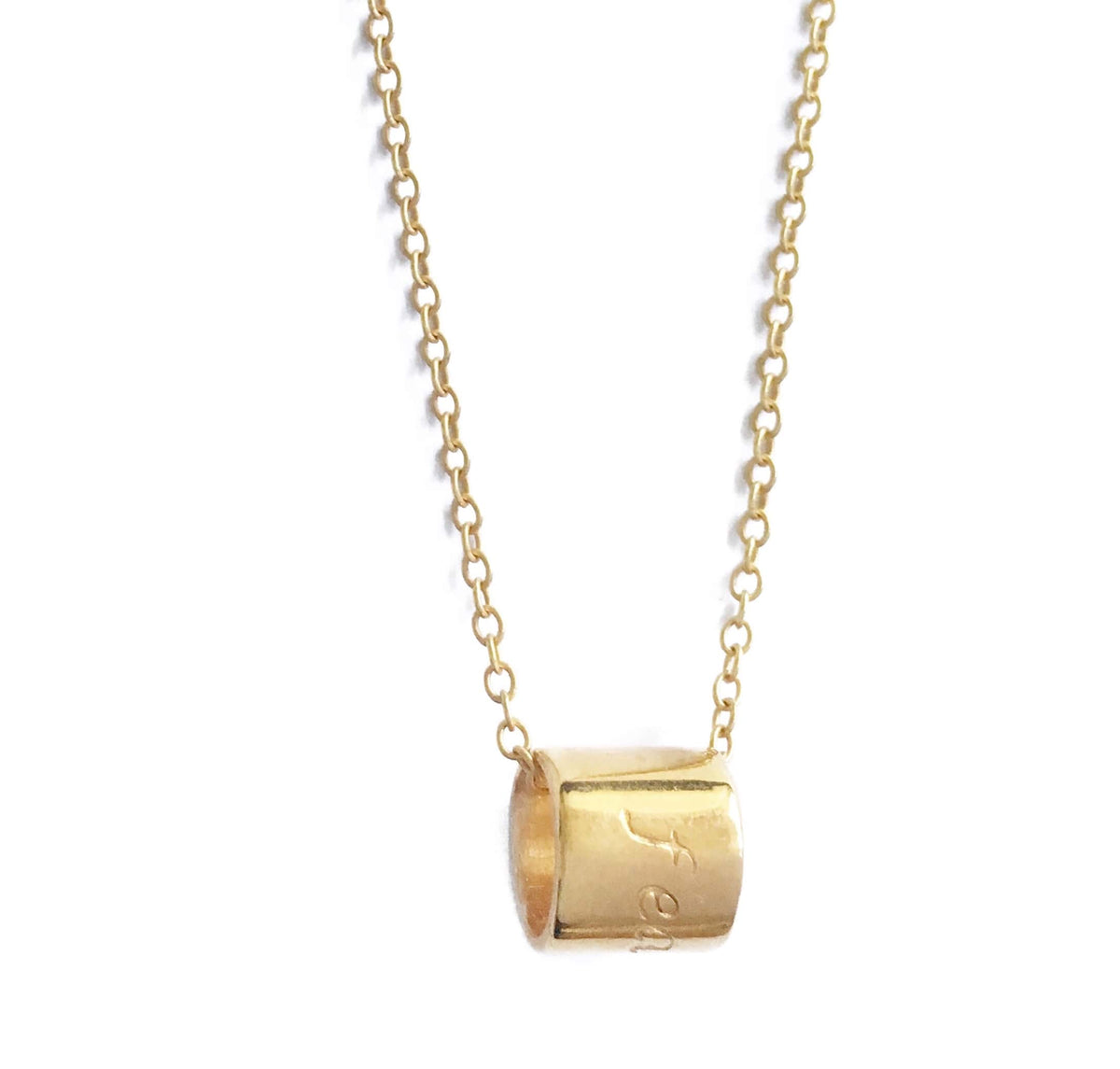 Gold plated cylinder necklace stamped with fearless